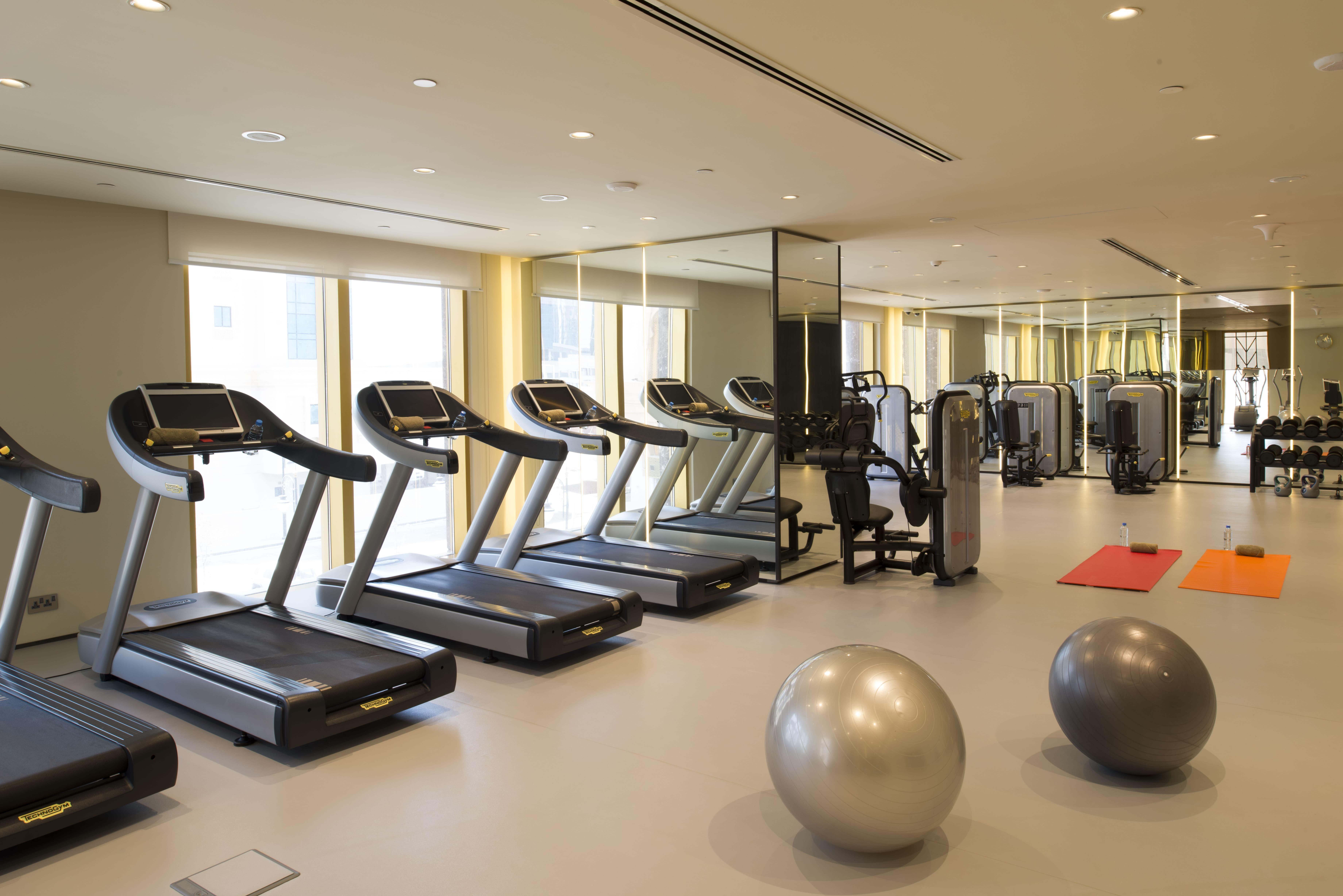 Voco Doha West Bay Suites By Ihg Exterior photo The gym at the hotel