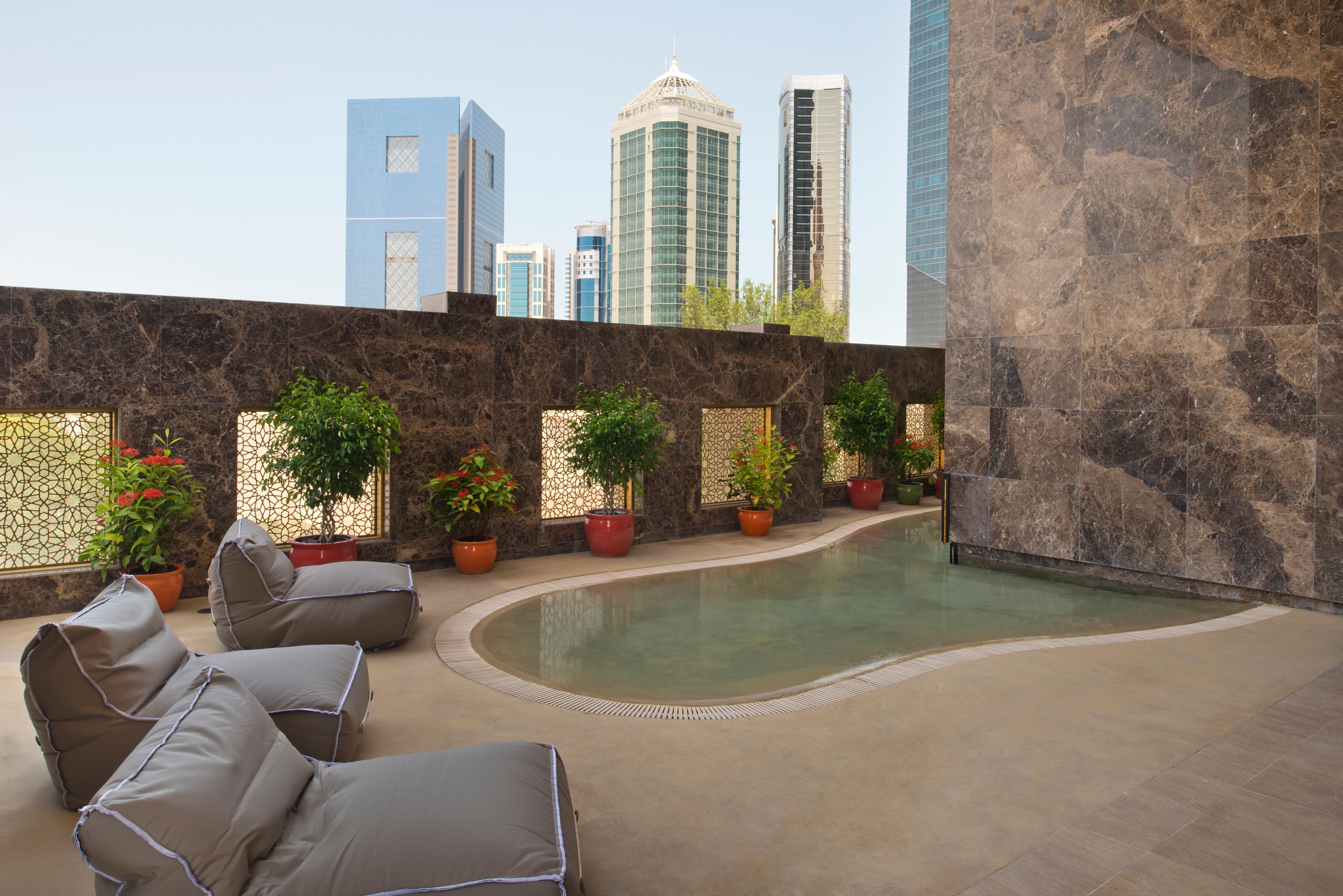 Voco Doha West Bay Suites By Ihg Exterior photo The pool at the Ritz-Carlton, DIFC