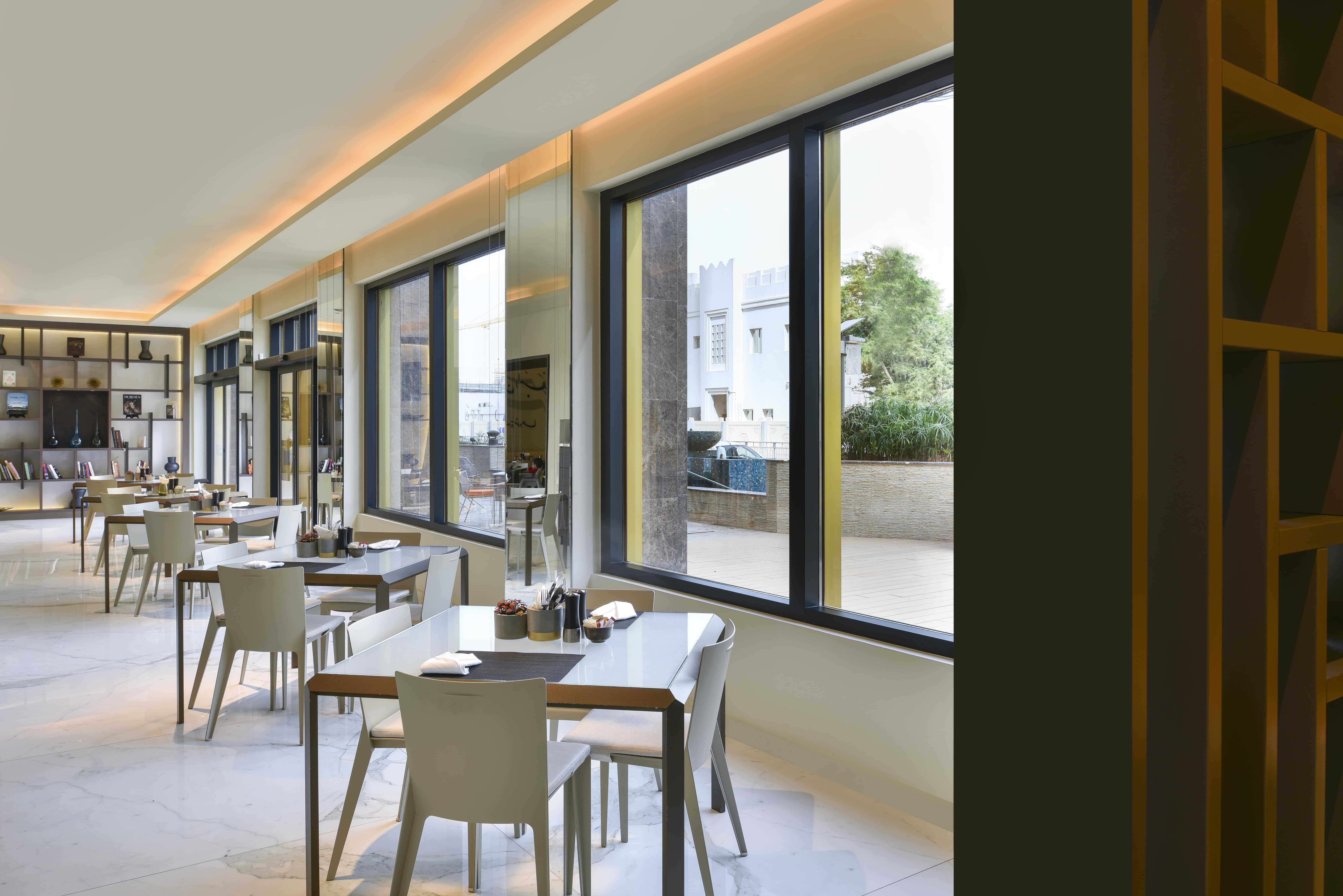 Voco Doha West Bay Suites By Ihg Exterior photo Restaurant