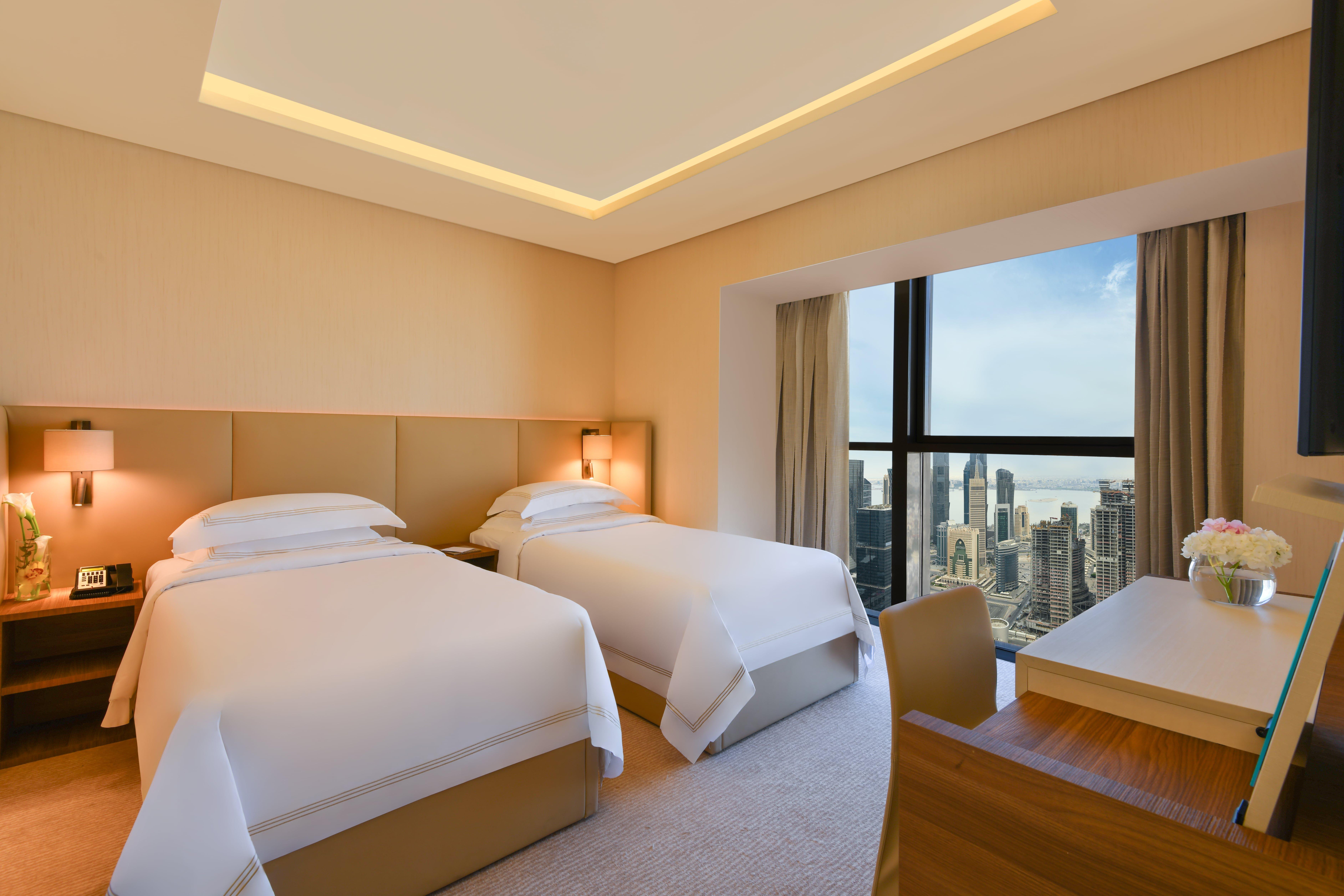Voco Doha West Bay Suites By Ihg Exterior photo Deluxe Room