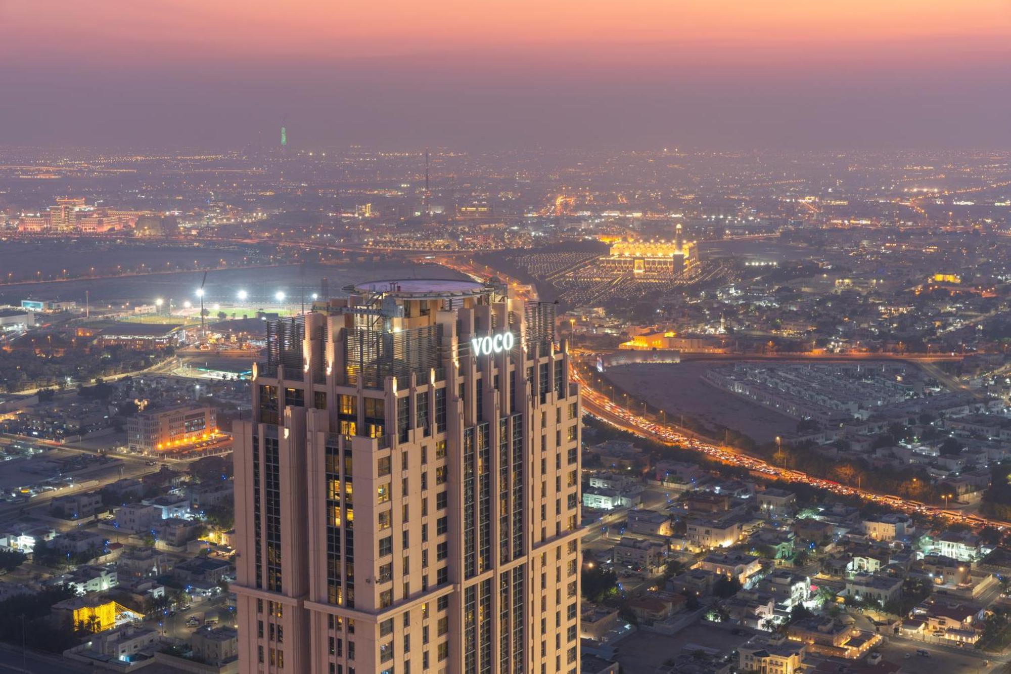 Voco Doha West Bay Suites By Ihg Exterior photo The 101 building at night